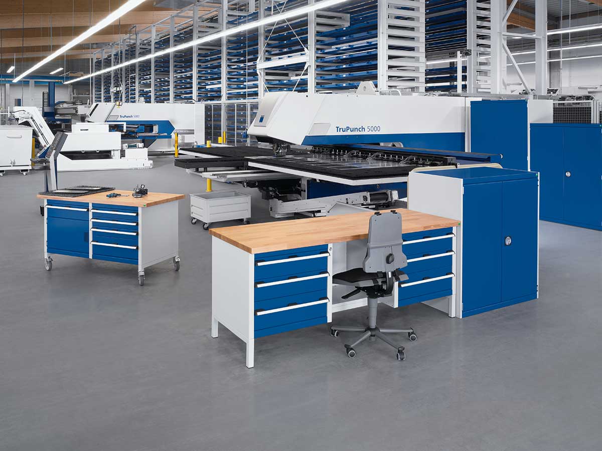 cubio factory equipment with stationary and mobile box workbenches.